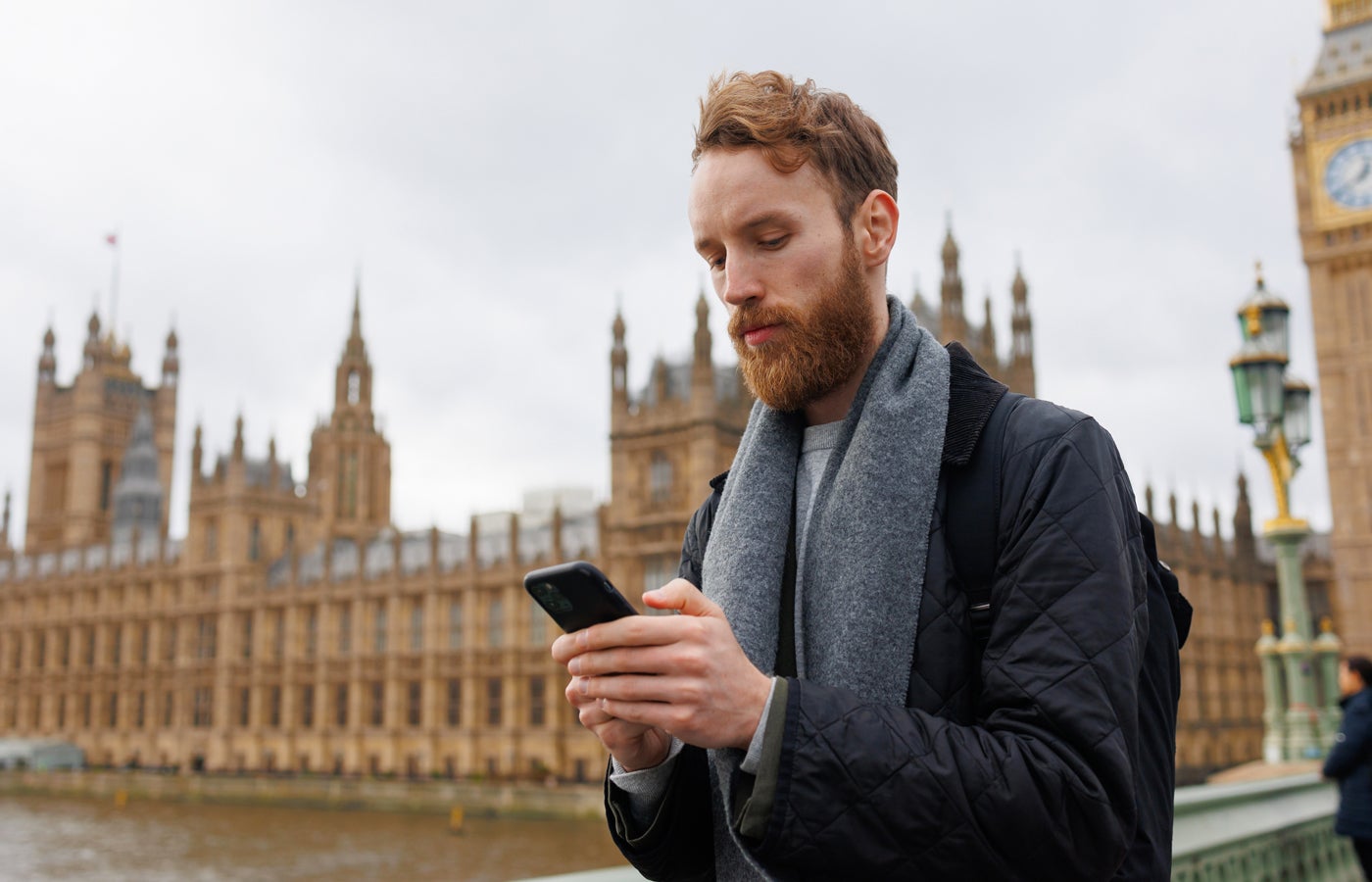 Portrait of a Man with a Smartphone in His Hands