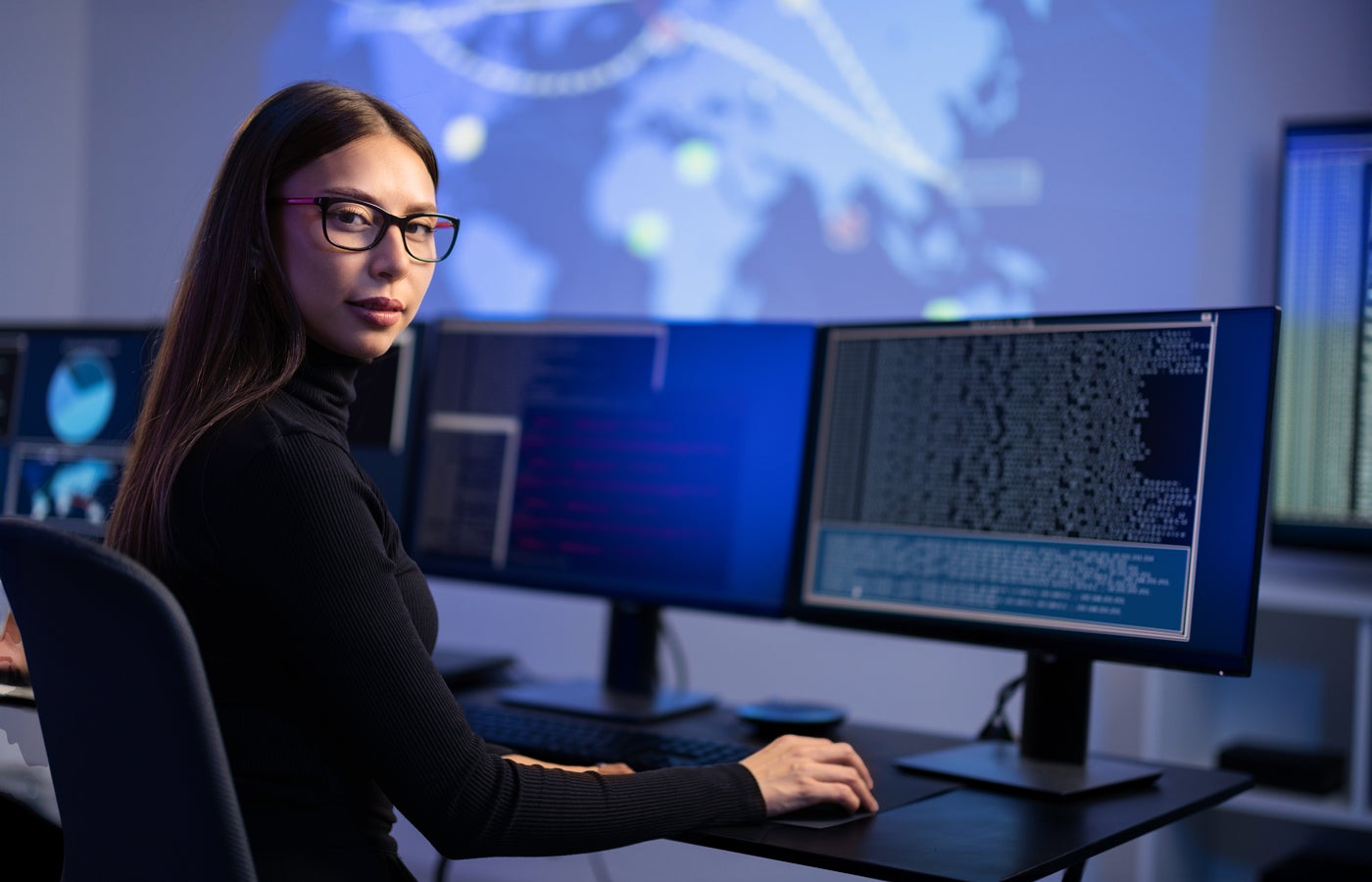 Female It Professional Working on a Desktop.